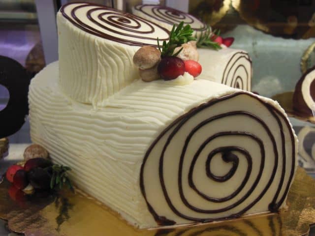 A "white bark" yule log can be made from mocha or vanilla frosting. Sprinkle the mushrooms with just a touch of cocoa to decorate their tops.