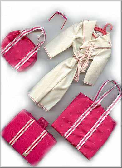 Barbie explained that her modeling job always keeps her on the go. For travel she has a soft leatherette "Genuine Barbie" tagged Trench Coat complete with sunglasses and matching luggage .