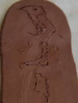 My children carved their names in hieroglyphics in clay (or play-doh) to make cartouches while we learned more about Egypt in the above link.