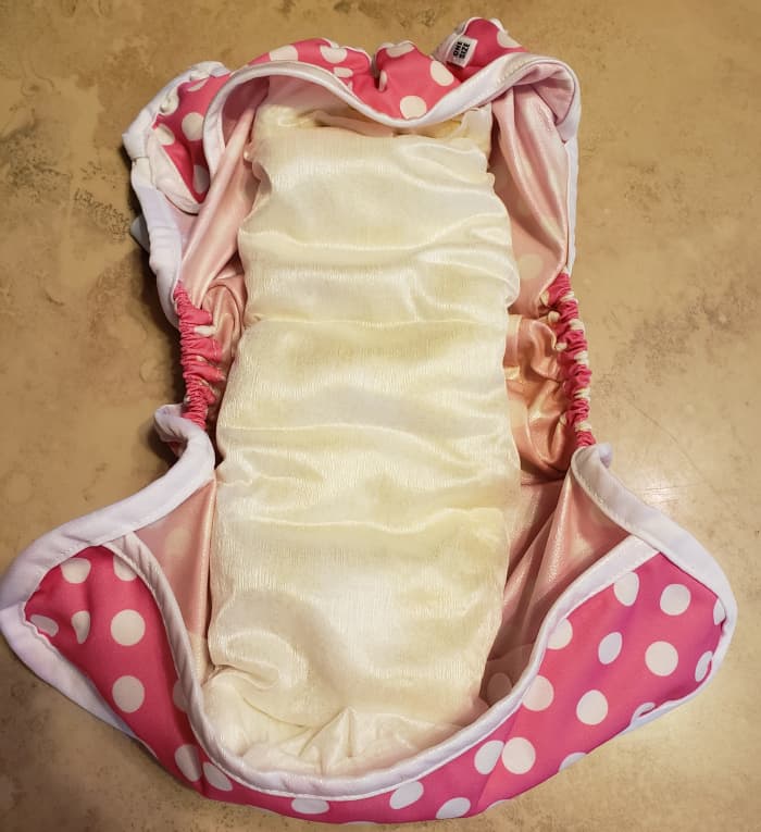 Fully Assembled Diaper and Cover: the diaper, liner and booster flip over and snap right into the cover. Once soiled, just unsnap the diaper, remove the liner and throw it and solids away. The covers come in lots of adorable patterns (above)