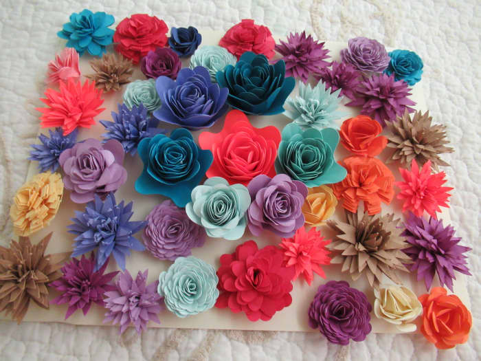 Here are just a few of my recently made rolled paper flowers. I keep them on hand for cards, scrapbook pages, wreaths and more