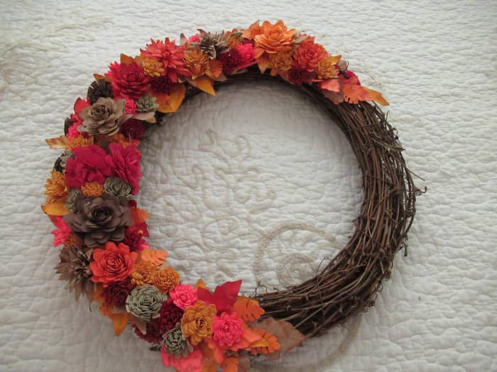 Rolled paper flowers are the perfect addition to any wreath. They can be done is seasonal colors. They can also be used for a baby shower in blue or pink. Chose white or bridal colors for a feature in bridal decor