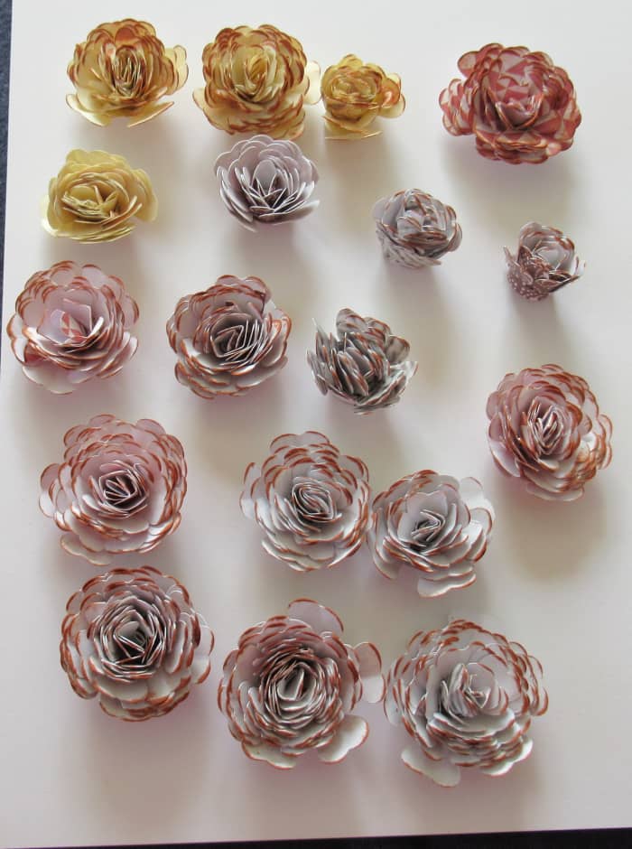 Gently run an ink pad over the top of your rolled flowers to create additional definition. I used a Momento ink called Potters Clay to create the drfinition on these flowers.