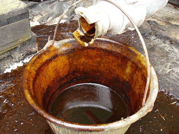 Molasses on a dairy farm in France (probably used as "molassed sugar beet feed", as an additive to cattle fodder)