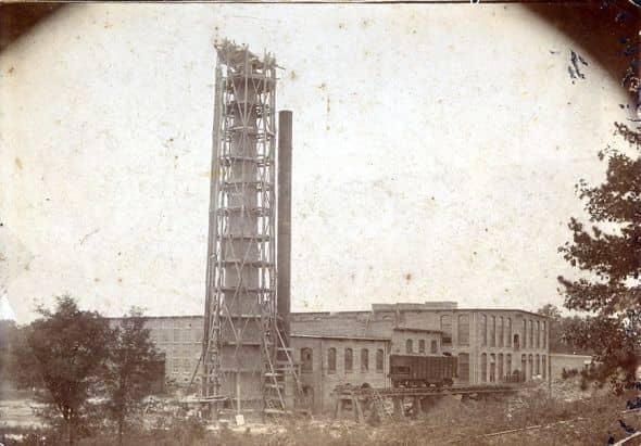 Nell said that her dad helped to build this smokestack at the Pendleton Cotton Mill in 1910. On the back of the photo was a note written by Virginia Boggs McKnight which reads:Papa (Charles Jackson Boggs) helped build this. A turkey dinner is being s