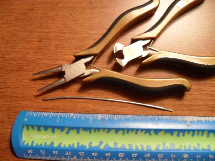 A ruler, some chain nose pliers and some wire cutters plus a length of silver wire is about all that is needed to make this quick and easy silver necklace clasp.
