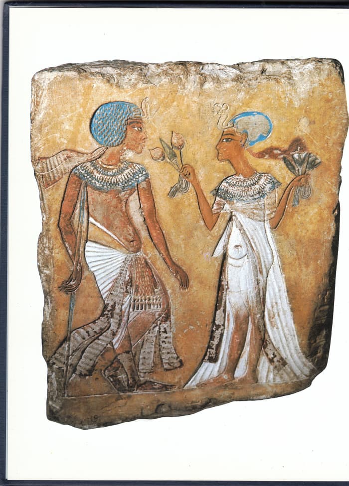 Painted limestone relief with Merytaten offering mandrake fruit to her husband, Smenkhkare in the Berlin Museum