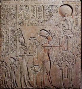 This limestone relief found in the Royal Tomb at Amarna depicts Akhenaton, Nefertiti,and two of their daughters making an offering to the Sun-disk, Aten