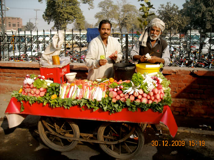 Carts like these are seen at every corner....vegtables are often cut and and sprinkled with spice. Below is roasted corn and chickpeas - another popular snack!