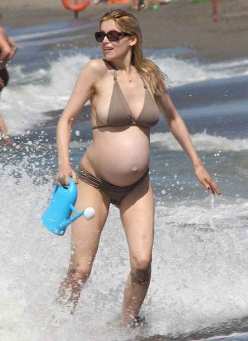 laetitia Casta in Swimwear when she was pregnant