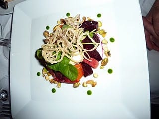 Roasted baby beets highlight a seasonal salad that also features watercress, pistachios and a Rock Hill Creamery feta mousse with a fine blood-orange vinaigrette.