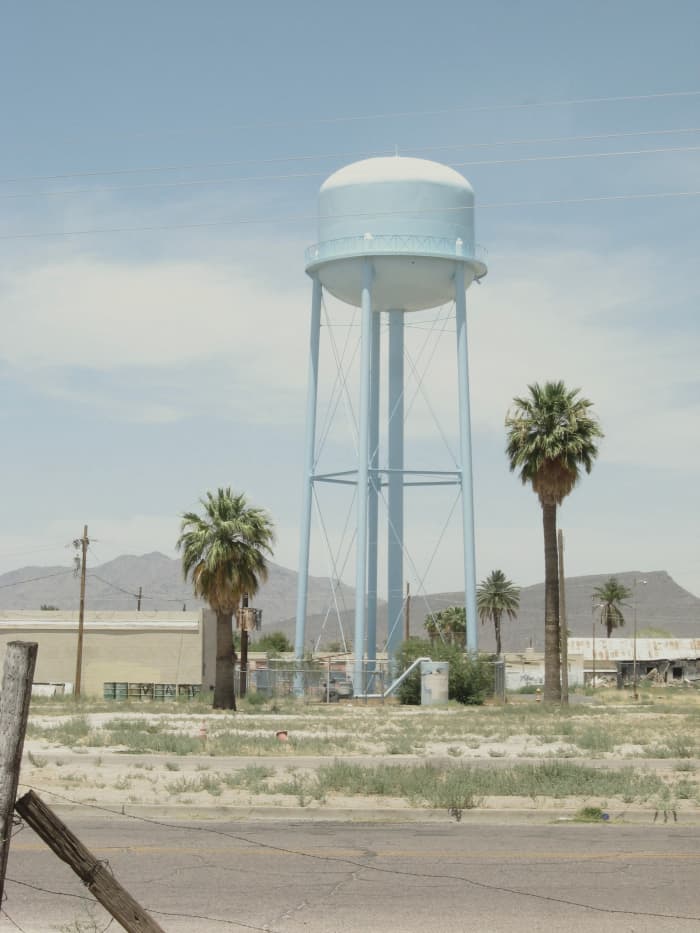 Large water tower across the street from the historic Cook Church in Sacaton, AZ