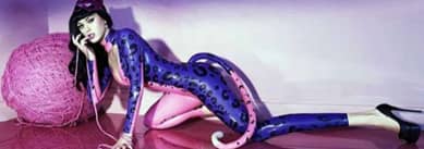 Katy Perry attractively poses for the launch of her top perfume, Purr in a catsuit photographed by Miles Alridge