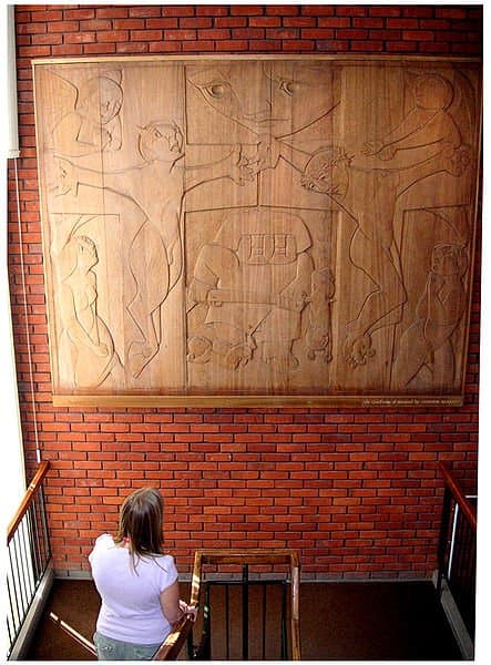 Photo of Connor Barrett's mahogany wood carving, The Crucifixion of Mankind, located in the Colchester Public Library, England . The picture was taken by Sandie Keeble of the Colchester library staff for Carptrash 14:17, 2 September 2006.