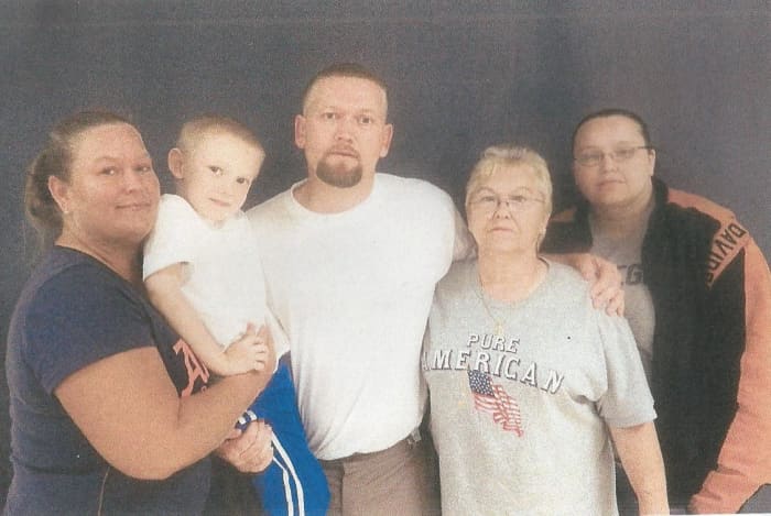 Here you have Michaels Sister Amanda on the far right. Coming left is his Mom Carolyn, then Michael, Michael's son Michael, and then his sister Dana. This photo was taken while Michael has been in prison.