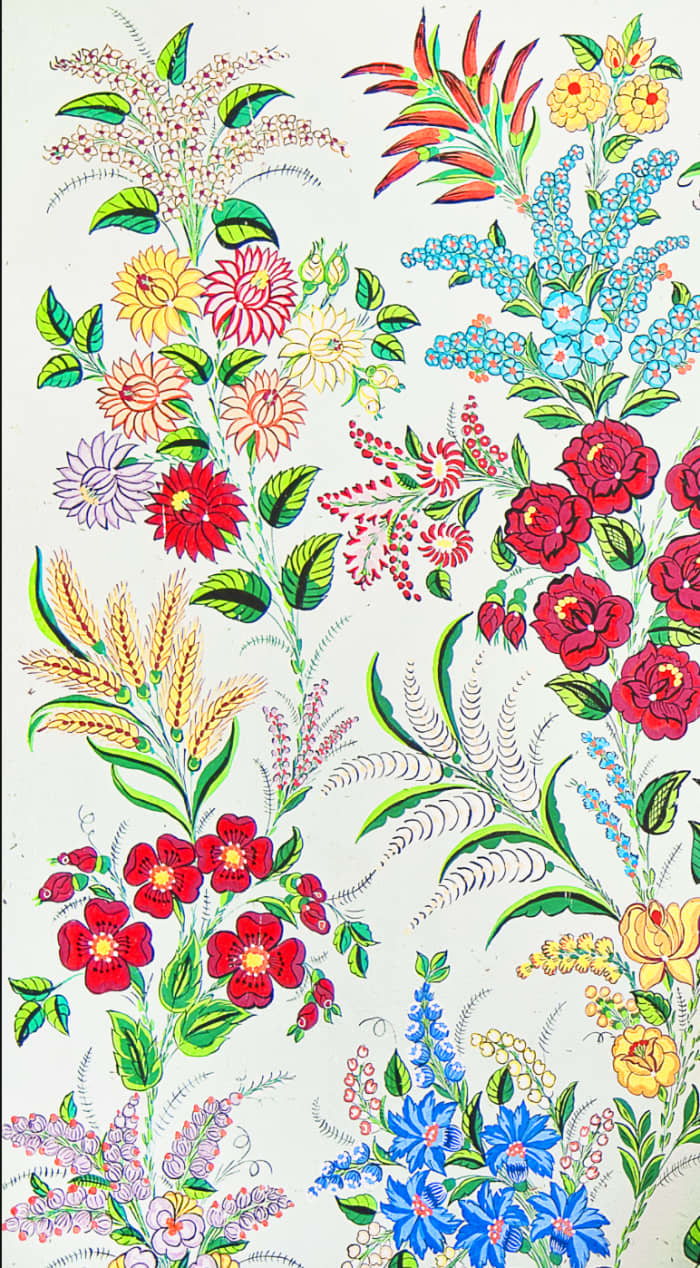 Can you name the flowers? Roses, dahlias, bellflowers are some of those included in this floral design.