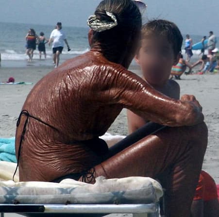 This woman's skin is like pure leather. Wrinkled and burned. It is so aged, she looks at least 80 years old.
