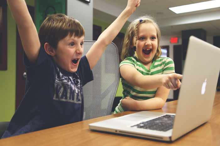 These children are having fun at their computer, but hopelfully they enjoy Mom or Dad reading to them.