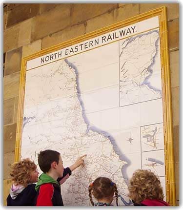 In 2009 a new tile map was added to the station wall at Pickering in the style of tile map found across the NER system at larger stations. One of a group of children points to her own local station on the western edge of the North Yorkshire Moors