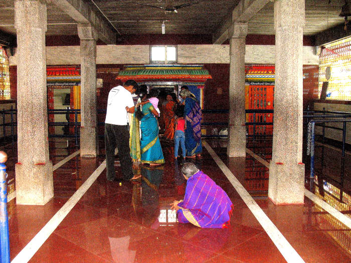 The preist prays for each devotee after the devotee touches the basket of flowers and says his gotra,birth star and name of his entire family.