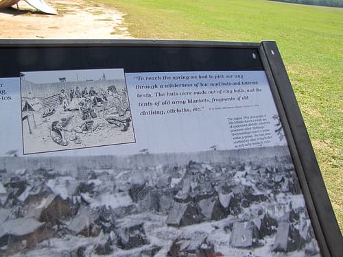 Some prisoners assembled tents with whatever they could, but many had no shelter at all from the harsh southern sun or winter weather.
