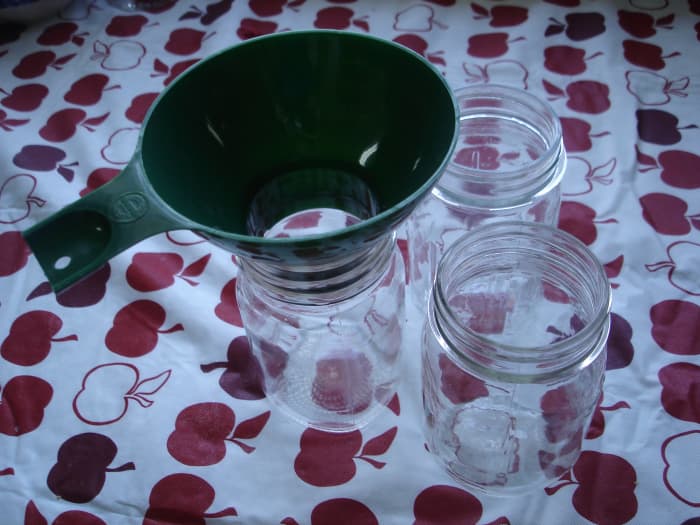 Step 6: You should have clean, pint or half-pint jars or containers ready to fill with the jam. A canning funnel is a big help to keep from making a great sticky mess.