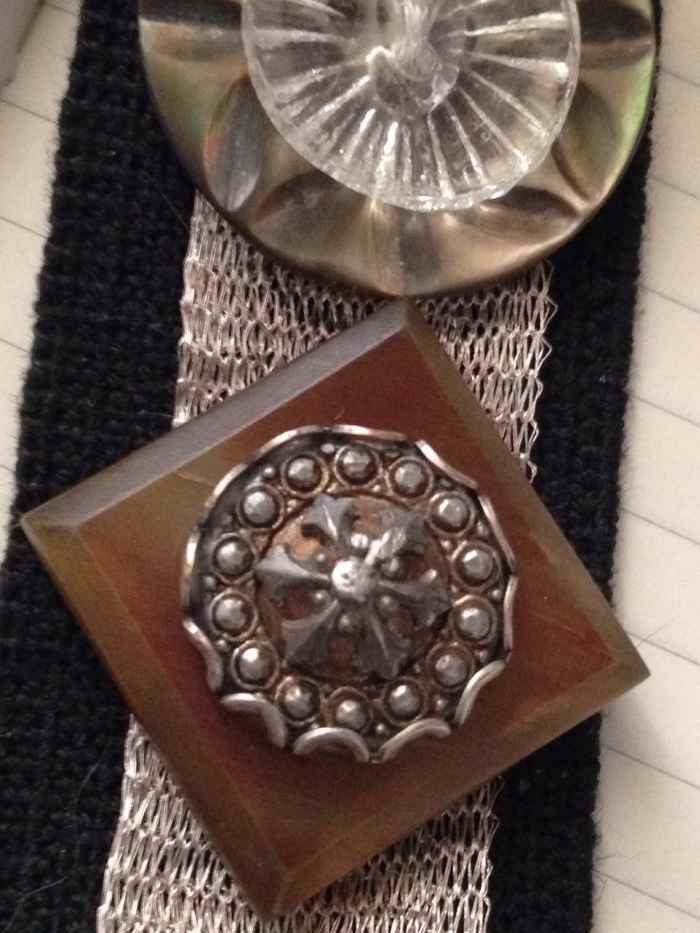 Celluloid buttons are gorgeous. They were often used for coats. Stacked button creations are a fun and easy way to showcase your favorite buttons. Here, I stitched the buttons to a wide piece of black elastic for a cuff bracelet I created.