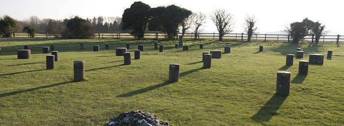 Woodhenge: a Neolithic monument, dating from about 2300 BC, with concrete markers replacing six concentric rings of timber posts, once possibly supporting a ring-shaped building.