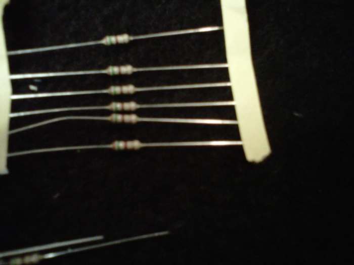 Resistors. They can be installed any which way, there is no polarity, no + or - with these guys.