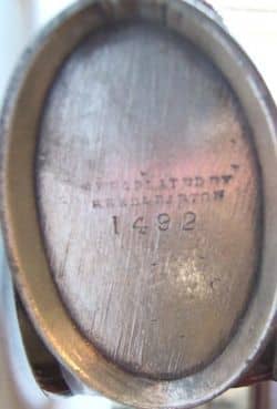 This image shows how the trademark for my figural napkin ring looks. This is made by Reed and Barton and shows a catalog number.