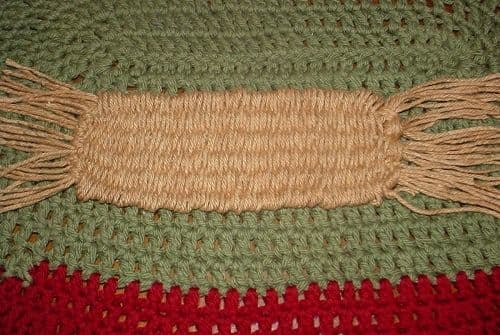 The straw weaver can make quick work of a woven belt project, woven straps, or anything else you wish to weave. This bookmark was done in less than an hour on the weaving tool. Turned on it's side, it's easy to see how simply weaving longer can creat