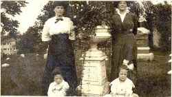 A photograph of Selma, Felix and Lillian Asplund sitting in the tombs of the Asplund shortly after the tragedy of the Titanic and Carl's funeral in Worcester, Massachusetts, USA.