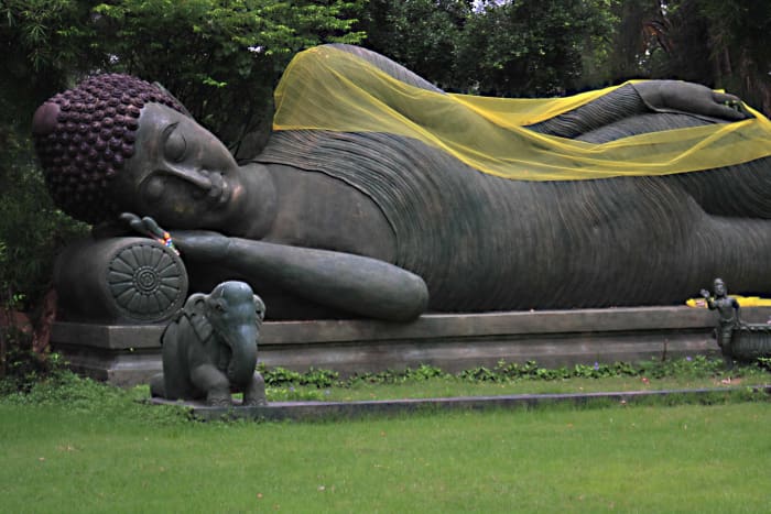 The Reclining Buddha. Representations of different postures of Buddha are symbolic of different phases of his life.The Reclining Buddha portrays him entering Nirvana upon death