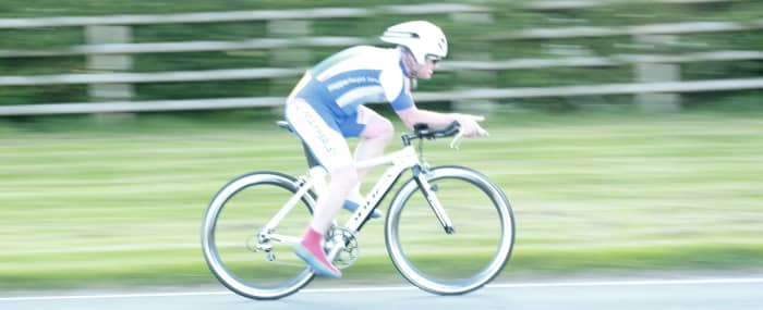 A cycling Panning Photo- following the cyclist in focus through the shutter trigger and release mechanism 1/60th sec, F4.0 ISO 400.