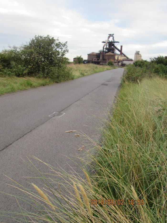 Away to the west, the now defunct Warrenby steel plant stands idle beside the road to Coatham and Redcar...