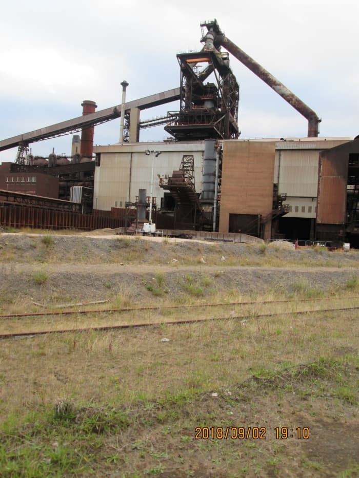 Some fairly recent additions, including an office block, have been left to gather dust and rust. A look across the now unused rail tracks shows other recent introductions left to the elements.