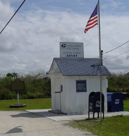 The Ochopee Post Office is the smallest post office in the USA. The one time storage facility for irrigation pipes was made into a post office in 1953. The post office is fully functional and owned by the Wooten family.