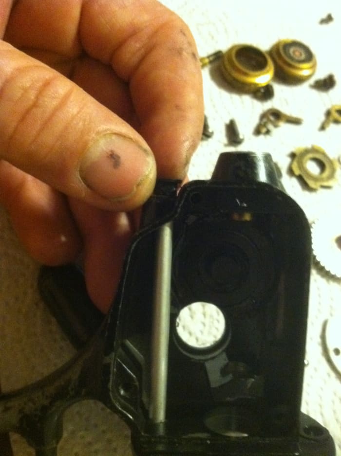 slide eccentric through the top of the rotor plate down throught he botom of the reel frame and slide the eccenric bushing over the shaft, Secure the eccenttric lever to the bottom of the shaft with the small flat head screw