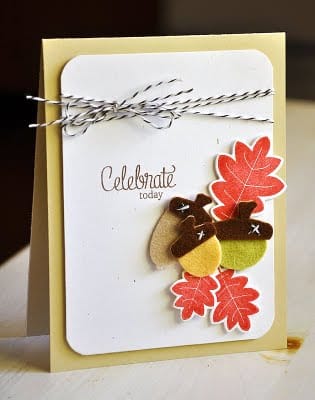 I love how Mailles mixed paper and felt embellishments, finished with a ribbon to add even more texture.