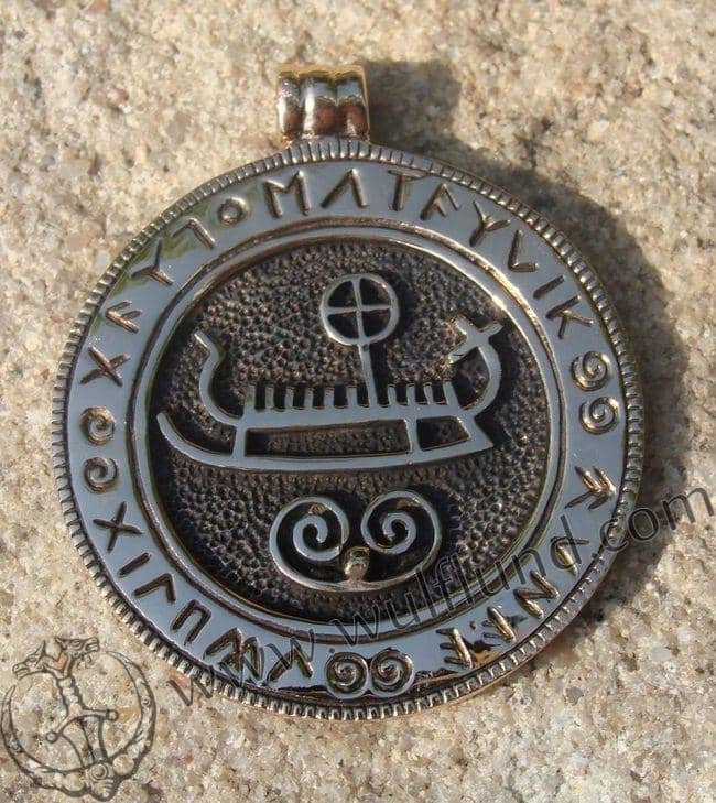 Modern reproduction Viking ship pendant with accompanying runes - they were used for protection, for curses or to convey praise for dead warriors and so on