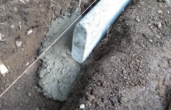 Extend the bed beyond the end of the last stone you intend to lay so that when you add more bedding concrete, it will merge with it.