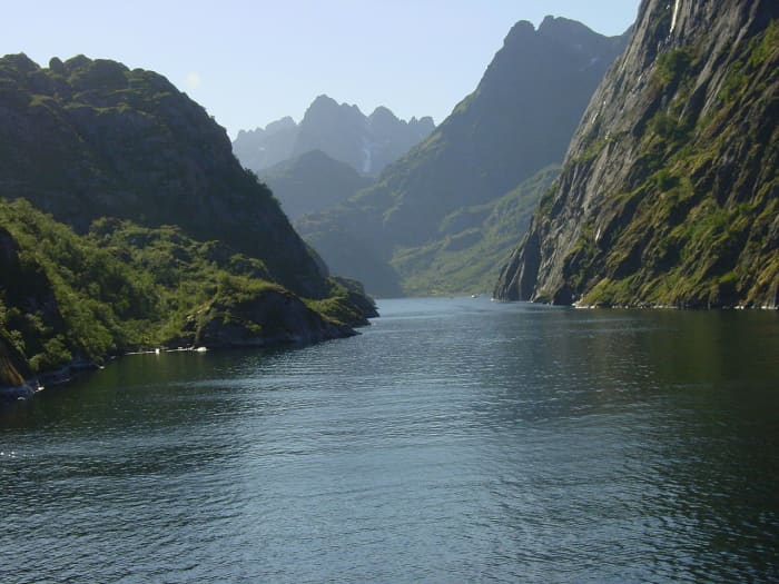 A secluded fjord in Norway surrounded by high cliffs and very protected