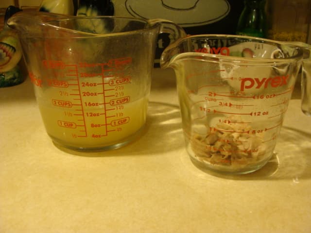 Here's my finished broth and the chicken I picked off the bones/trimmings. You can toss it on a salad, save it for a soup. I have a puppy we're training, so these little morsels will be treats for him.