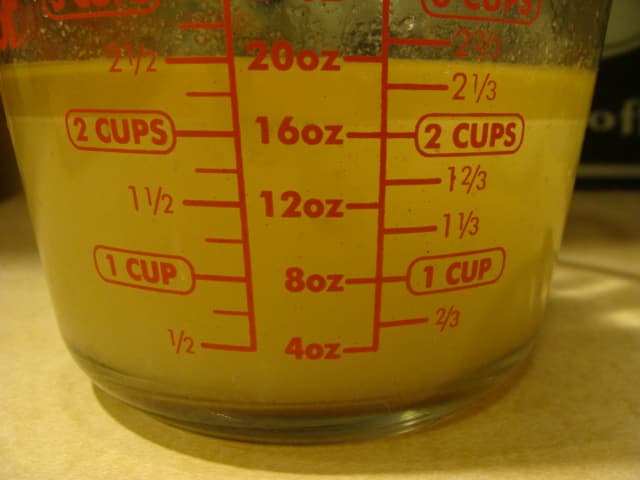 once it settles, you'll notice that the fat has risen in a layer on the top. You can spoon it off the top, but I have a little kitchen gadget that makes it easier to separate it.