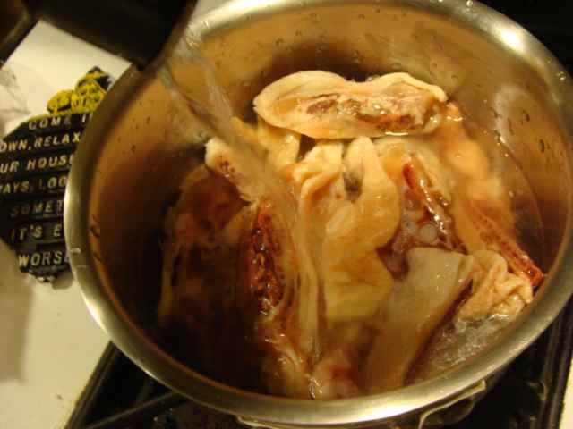 Put your bones and trimmings in a pot and cover with water. This is the base for your chicken broth.