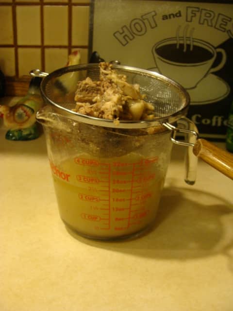 Be sure you have something large to catch your broth in when you strain. Don't laugh, my husband was making some & all the broth went down the sink! Use a strainer or colander to catch the large solids. You can pick the meat off the bone if you like