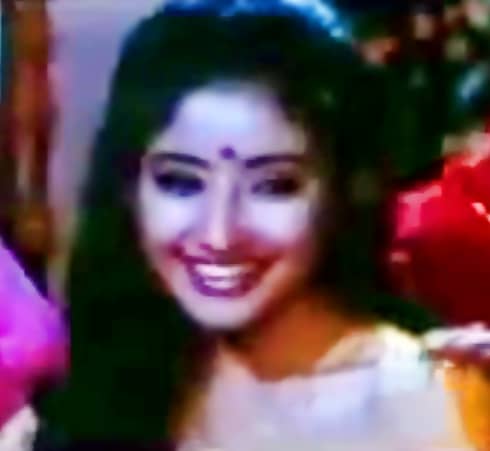 Manisha Koirala in "Banno teri ankhiyan" from Dushmani: a song for the haldi ceremony, part of preparing the bride for marriage.