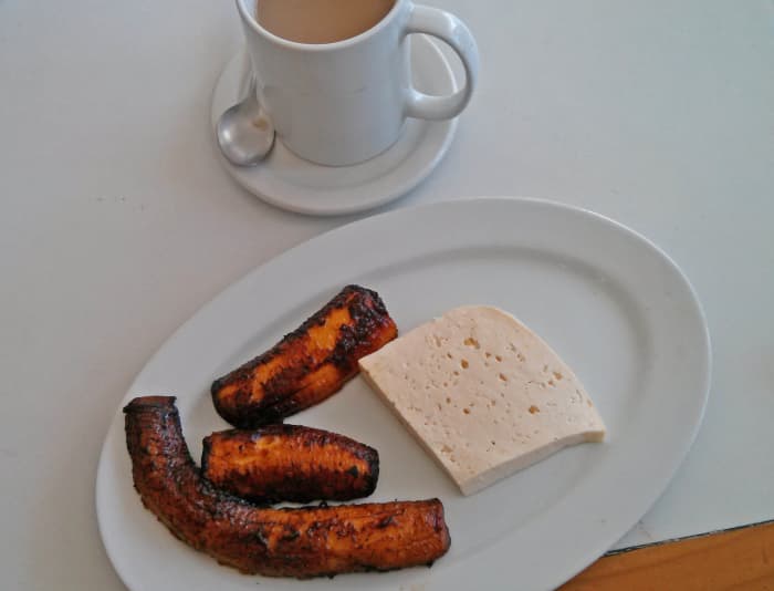 For a quick pick-me-up and snack, have a cup of coffee with cooked mature plantain and fresh white cheese. All three flavors complement each other quite well.