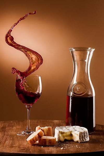 Stefan Krause, Germany. Tabletop photography by "Studiocommunity e.V." (incorporated association). No photomontage was used. All objects were fastened on the board, which was pushed from the side, causing the wine to spill out of the glass. Produced