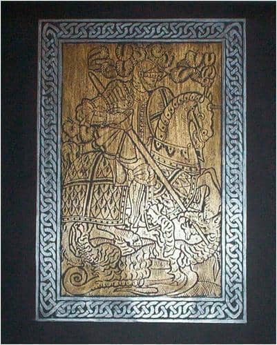 Brass rubbing of St. George and the Dragon using a bronze crayon for St. George and a silver crayon for the frame around the picture.